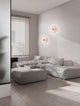 Edem LED Wandleuchte Ø 25cm 3000K an einer modernen Wand im Wohnzimmer