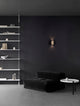 Elli LED Wandleuchte 3000K Schwarz, Braun an moderner Wand in stilvollem Wohnraum.