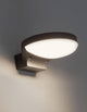 Enzi LED Außenwandleuchte 3000K Dunkelgrau IP54 an einer Wand montiert mit warmweißem Licht.