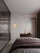 Esti LED Wandleuchte Ø 32cm 3000K in modernem Schlafzimmer mit stilvollem Design.