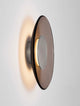 Esti LED Wandleuchte Ø 32cm 3000K an einer Wand montiert, modernes Design mit sanftem Licht.