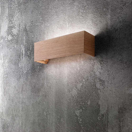 Badia LED Wandleuchte Braun an einer grauen Wand, modernes und elegantes Design.