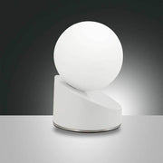 Gravity LED table lamp made of metal & glass with a minimalist shape and white glass globe.