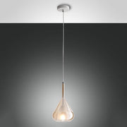 Purple distinctive glass pendant light in amber, elegant amber-colored glass decoration for stylish lighting.