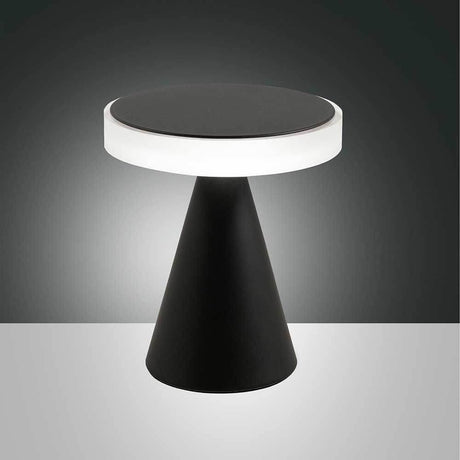 moderne LED-bordlampe Neutra på et minimalistisk bord med svart og hvitt design.