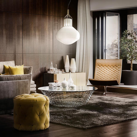 Fabbian Aérostat pendant light Ø 43cm in a modern living room with elegant furniture.