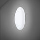 Fabbian Lumi Wandleuchte White Small an einer Wand montiert mit elegantem Design aus weißem Glas.