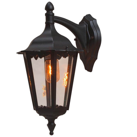 Luminária de parede externa Firenze preta, vidro claro com design estiloso e luz quente para áreas externas.