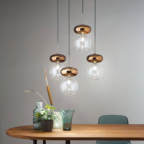 Unica Hängeleuchte Brosilikatglas 4-flammig im modernen Design mit bronzefarbenen Details und eleganten Glaselementen.