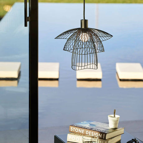 Forestier Papillon pendant light Ø 30cm above a table with a view of the water.