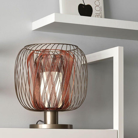 Forestier table lamp Bodyless on a shelf, modern design with woven metal and diffuser.