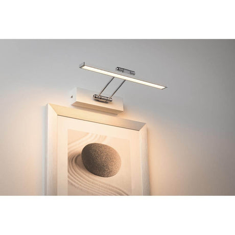 Galeria picture light LED Beam Thirty 5W white mounted above a work of art with warm white light.
