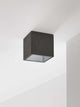 Gantlights B7 Deckenspot quadratisch dimmbar aus grauem Beton, innen vergoldet/versilbert/verkupfert, minimalistischer Kubus an weißer Decke