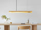 Gantlights C2 o/n LED-Pendellampe 92cm dimmbar über einem modernen Tisch in stilvollem Raum.