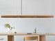 Gantlights C3 o/n LED-Pendelleuchte 182cm dimmbar über minimalistischer Esstisch-Umgebung.