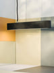 Gantlights S4 Beton LED-Pendelleuchte 61cm Plissiert über modernen Wänden in sanften Farben.
