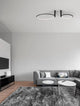 Garve LED Deckenleuchte 2-flammig Ø 60cm 3000K in modernem Wohnzimmer mit grauem Sofa und Teppich.