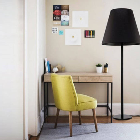 Giant XXL floor lamp 162 cm black next to desk and yellow chair in a modern room