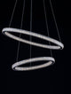 Ginevra LED Pendelleuchte 2-flammig Ø 60,5cm 3000K Schwarz - elegante schwarz-silberne Ringe in der Luft schwebend.