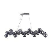 Modern dining table lamp Glob 120 cm chrome 25 smoke glasses with spherical lampshades made of tinted glass.