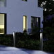 LED Pollerleuchte Sky IP54 65cm Graphit im Garten bei Nacht, stilvolle Außenbeleuchtung für moderne Häuser.