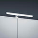 LED Wandlampe Gaia Chrom über einem Möbelstück montiert, stilvoll und modern gestaltet.