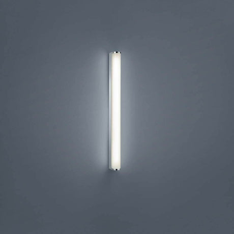 LED-vegglampe Ponto krom installert på en grå vegg, moderne og stilfull belysning