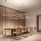 Panzeri Hilow LED pendant light over an elegant dining table in modern interior.