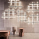 Panzeri Hilow LED pendant light in modern ambiance with creative light installations and elegant furniture.