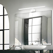 Alma LED mirror and wall light above a modern bathroom washbasin with mirror.
