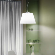 Pendant light Cylinder Sp1 D40 White above a table with green walls and white curtains.