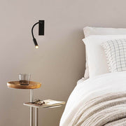 IO LED Reading arm wall light above the bed, ideal for reading in soft light.