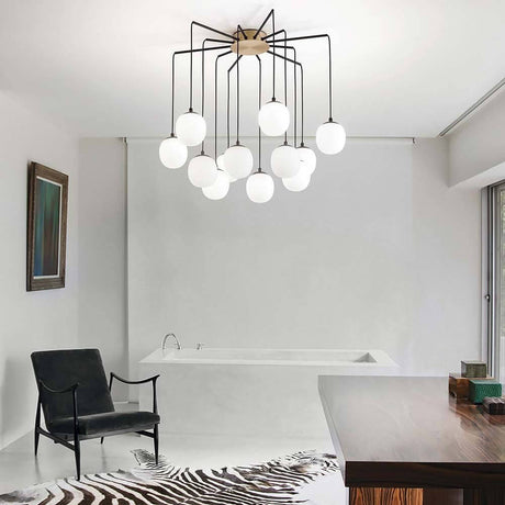 Suspension Rhapsody dans un salon moderne avec un design élégant et une répartition lumineuse unique.