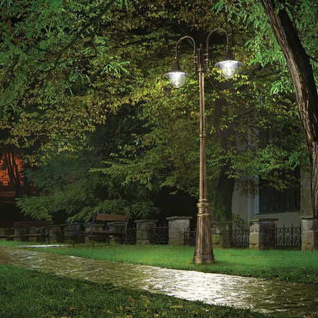 Floor lamp Cima Pt2 in a green park with evening lighting on a path.
