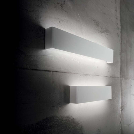 Wall light Bright Ap132 on a concrete wall, modern design with soft lighting.