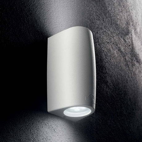 Keope Ap2 Small White wall light on a wall, modern design, ideal for ambient lighting.