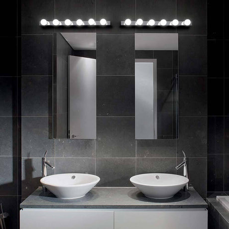 Wall light Prive Ap6 brass above two washbasins in a modern bathroom with mirrors.