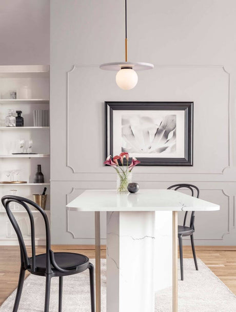 Idor pendant light Ø 30cm G9 marble above an elegant table in a modern dining area.