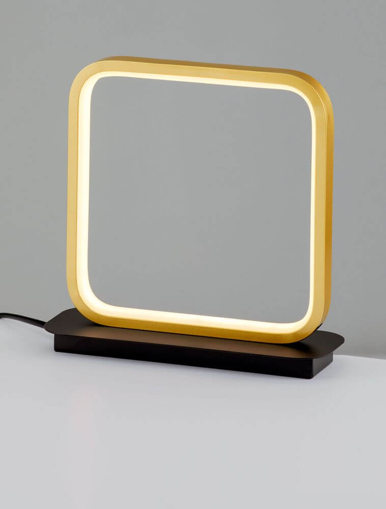 Imar LED Tischleuchte 3200K Schwarz, Gold auf einem Tisch, modernes Design mit warmem Licht.