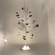 Wandleuchte La Festa delle Farfalle von Ingo Maurer mit 34 Schmetterlingen und LEDs in Weiß, designorientiert und verspielt.