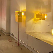 Ingo Maurer floor lamp 24 Karat Blau Floor golden light in yellow glowing, modern design in the room.
