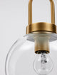 Irvine Pendelleuchte Ø 20cm Gold, Transparent – Nahaufnahme der Glühlampe und des goldenen Metalls.