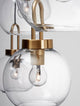 Irvine Pendelleuchte Balken 97,5cm 4-flammig Gold, Transparent mit klaren Glaskugeln und goldenen Details.