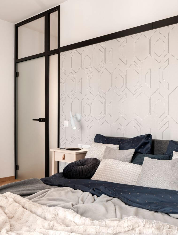 Gemütliches Schlafzimmer mit Joy LED Wandleuchte 3000K und modernem, geometrischem Wanddesign.