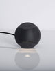 Joya LED Außenwandeinbauleuchte Up & Down 3000K Schwarz IP65 am Tisch mit Kabel.