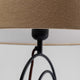 Detailansicht der Tischleuchte Face Wire Nature mit modernem Design und beige Baumwollschirm.
