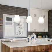 Casablanca cable pendant lamp Bagan, 3-light, above a modern kitchen island with white walls.
