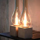 Karman Amarcord Tischlampe mit eleganten Glaskörpern und modernem Design auf einem Tisch.