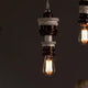 Karman Mek 1 Hängeleuchte Ø 10cm mit keramischer Fassung und Edison-Glühbirne in stilvollem Design.