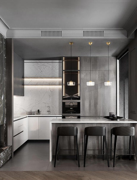 Modern kitchen design with Keros LED pendant light 3000K Gold above the kitchen island.
